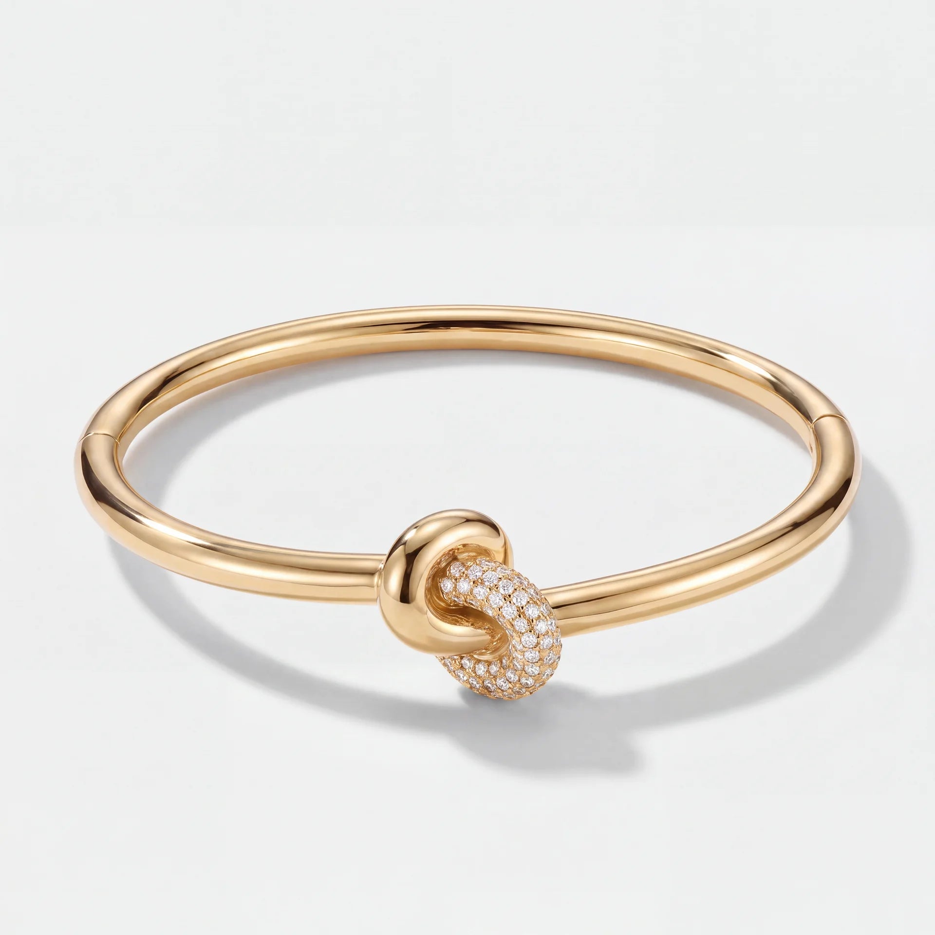 Brazalete Rígido Tennis - Nudo Central Oro